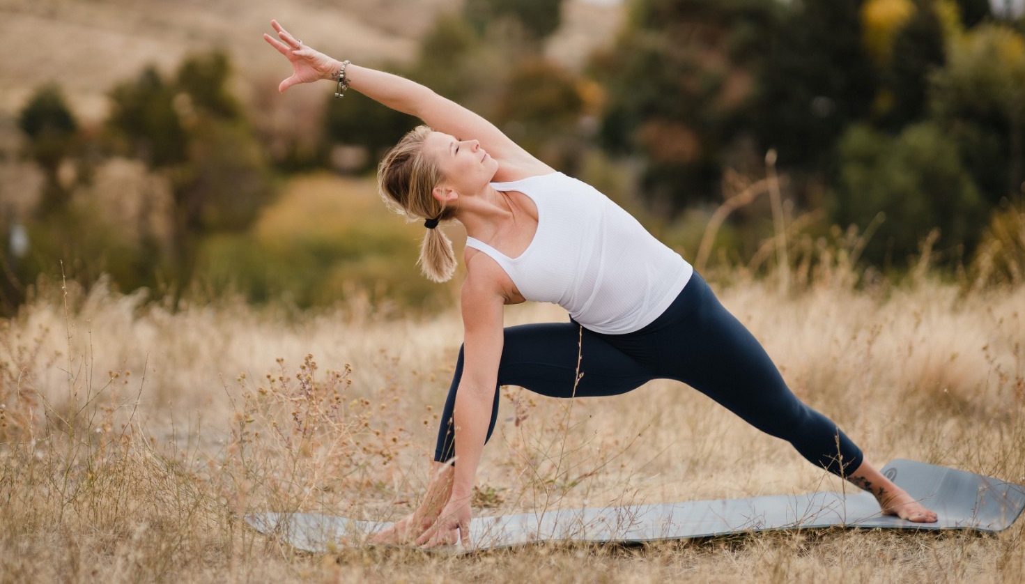 Megan Aaron yoga in a field